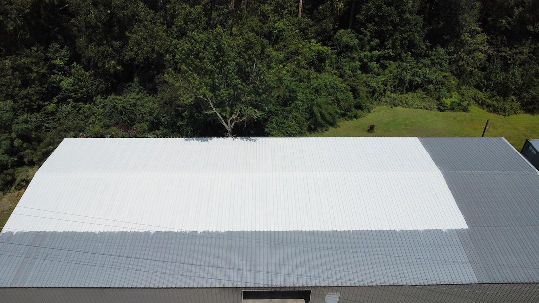 10-Year Uniflex Acrylic Waterproof System over the metal roof at Russell Hilton Cabinet Shop in Odum, GA